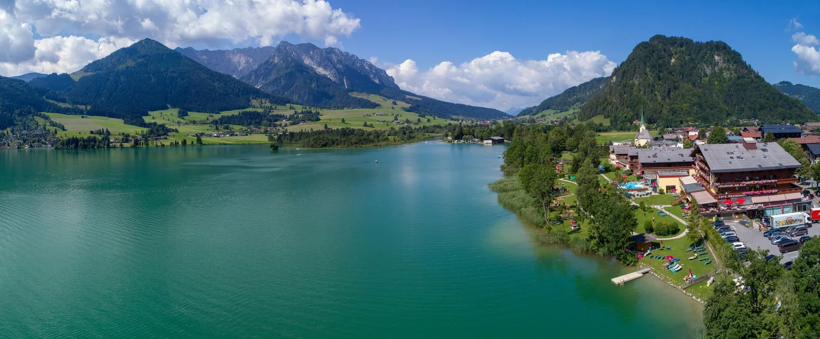 Ferienclub Bellevue am Walchsee Blick auf den Walchsee und die Berge beim Ferienclub Bellevue